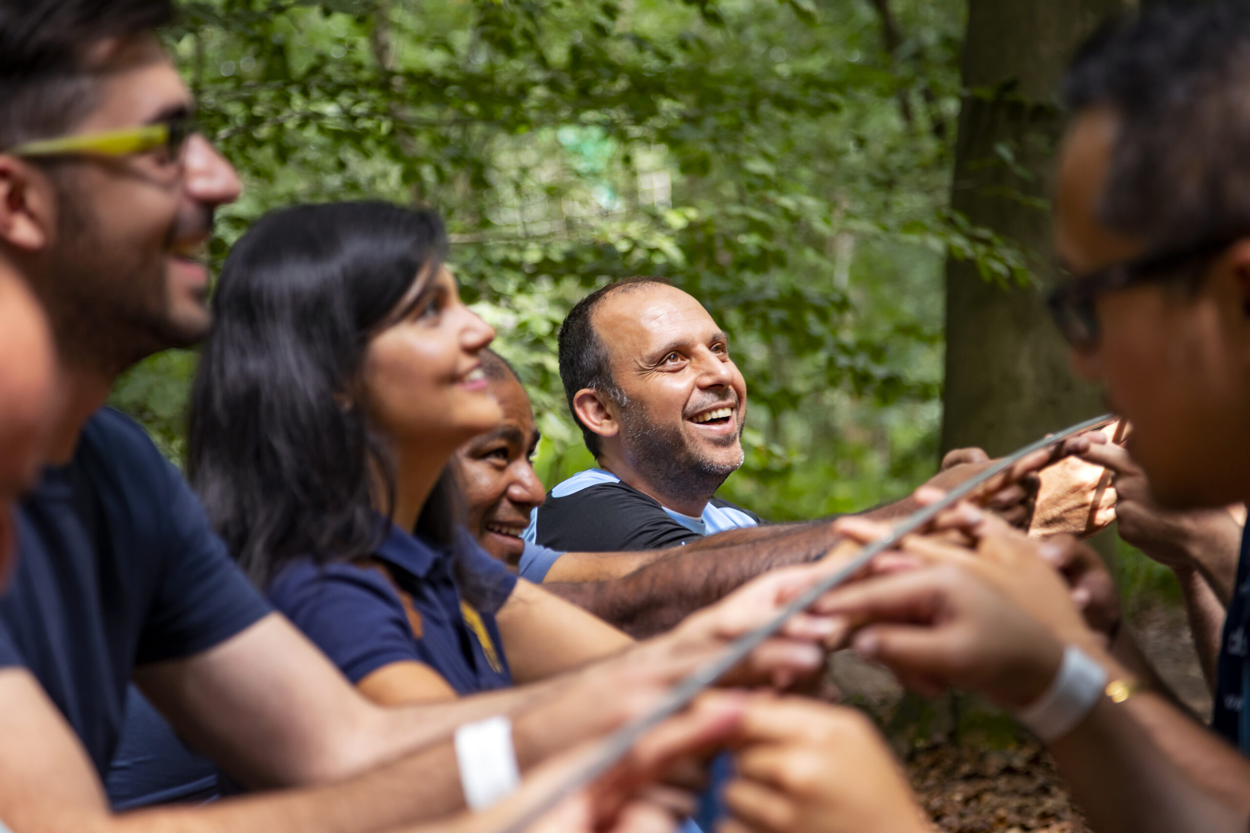 A group of adults participating in a team building activity