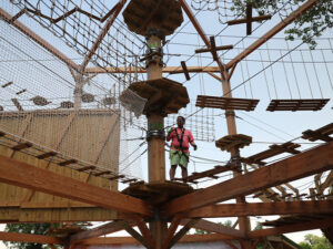 A man standing amongst many suspended bridges in the air in Houston, Texas