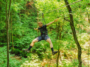 A man flying down a zipline in Indianapolis, Indiana