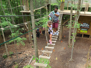 A parent completing a treetop crossing with a child in Springfield, Virginia